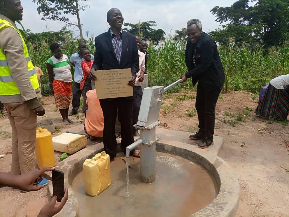 Henry Katabazi working on a water pump